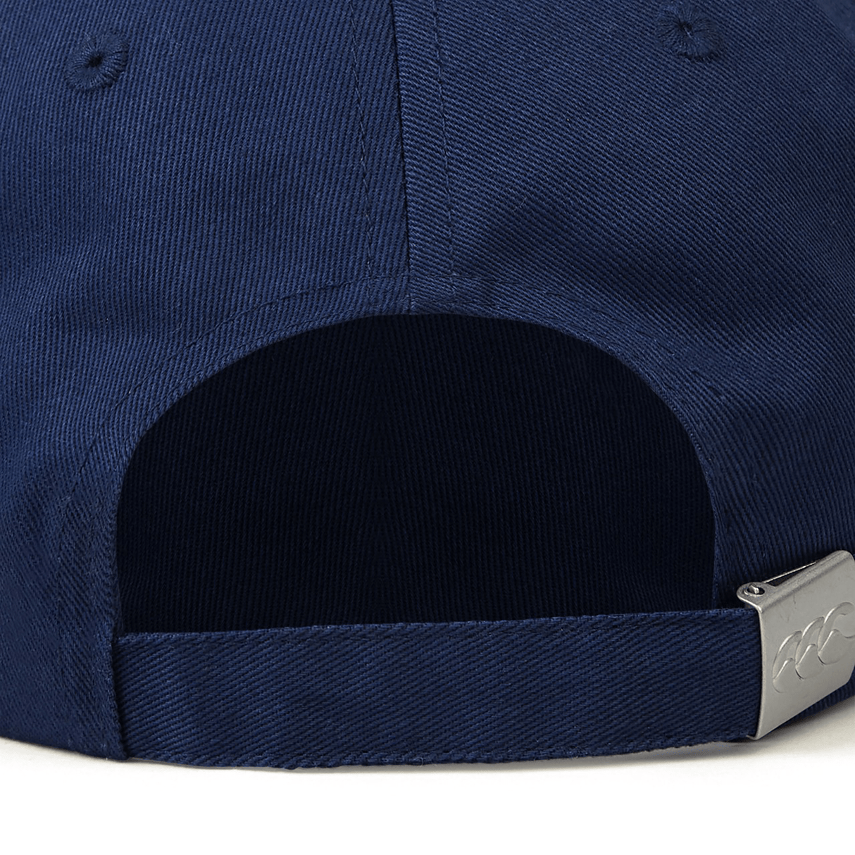 Rear view of a navy blue Canterbury Flexfit Drill Cap showcasing an adjustable strap with a metal clasp. This comfortable flex fit cap by Canterbury is designed for a perfect fit.