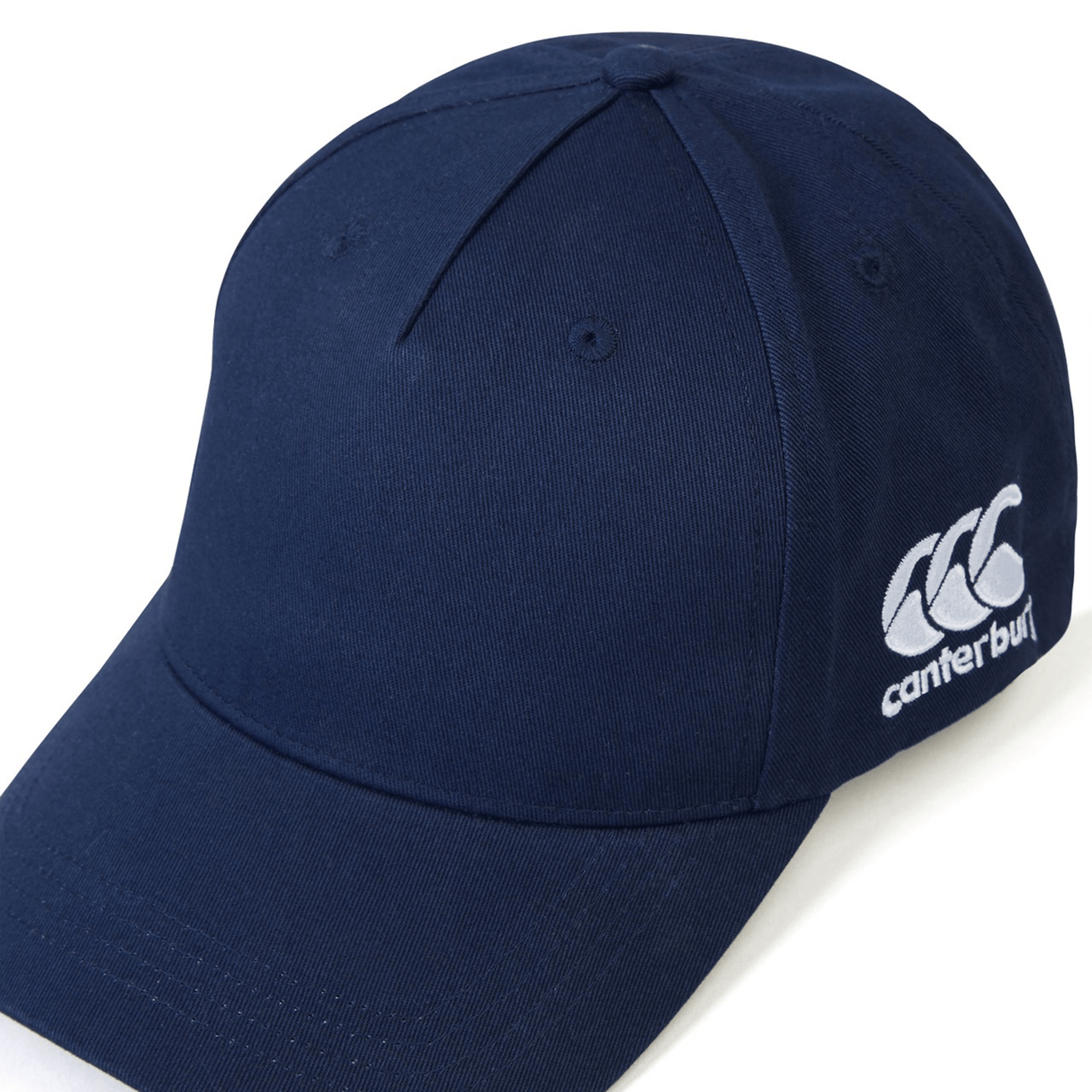 A navy blue Canterbury Flexfit Drill Cap with a white logo on the side, this comfortable flex fit cap from Canterbury is perfect for any occasion.