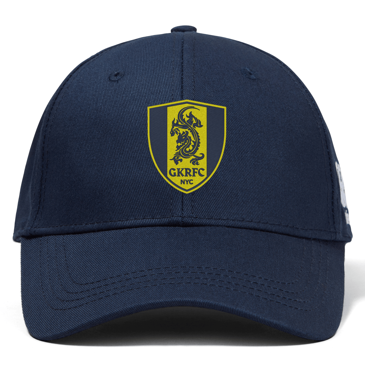 The Gotham Knights Flexfit Drill Cap by Canterbury, from EMB Canterbury, boasts a navy blue color with a curved brim. It features an embroidered yellow and blue shield logo with two lions and the text "GKRFC NYC" on the front.
