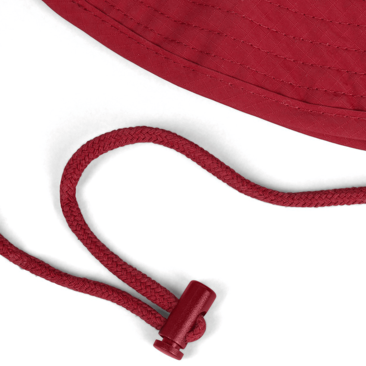 Close-up of the British & Irish Lions 2025 Wide Brim Bucket Hat by Canterbury, a red hat showcasing a braided cord and adjustable toggle, made with quick-dry ripstop fabric.