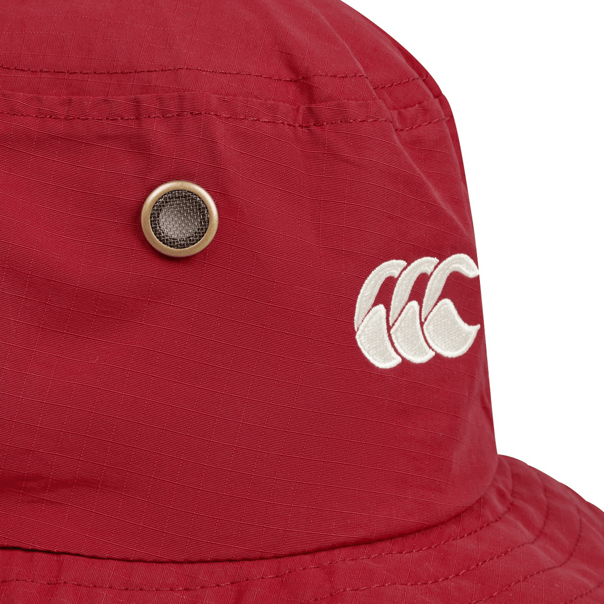 Close-up of the British & Irish Lions 2025 Wide Brim Bucket Hat by Canterbury, showcasing a red design with a white logo and metal eyelet, crafted from quick-dry ripstop fabric.