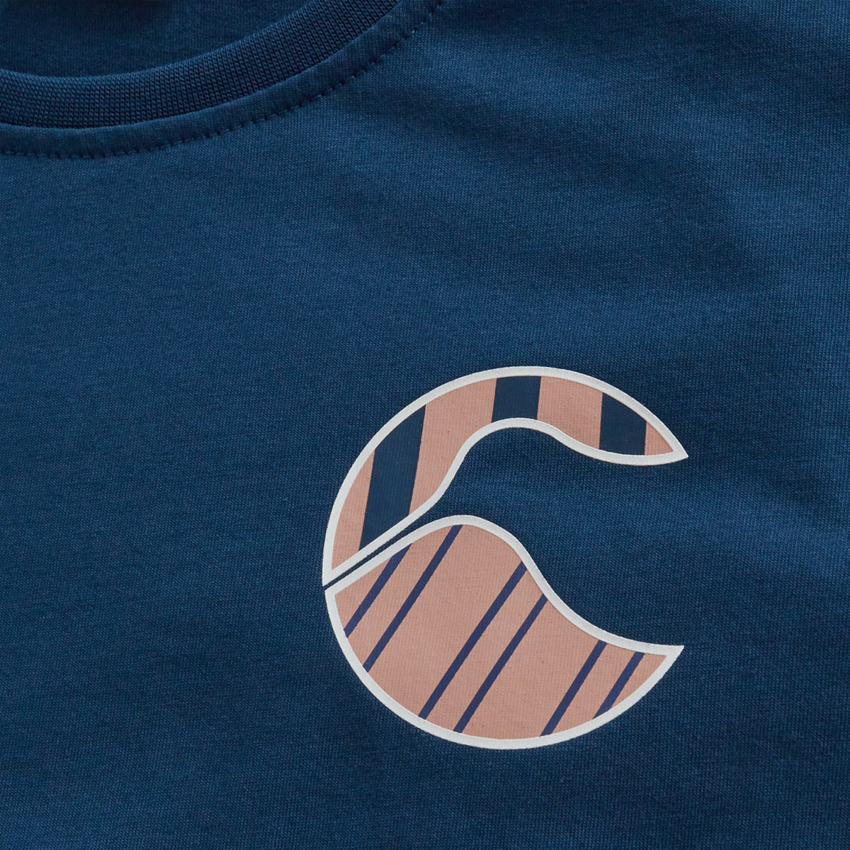 The Canterbury Women's Uglies Logo T-Shirt is a blue fabric rugby tee with a graphic design featuring a stylized pink "C" and blue diagonal and curved stripes.