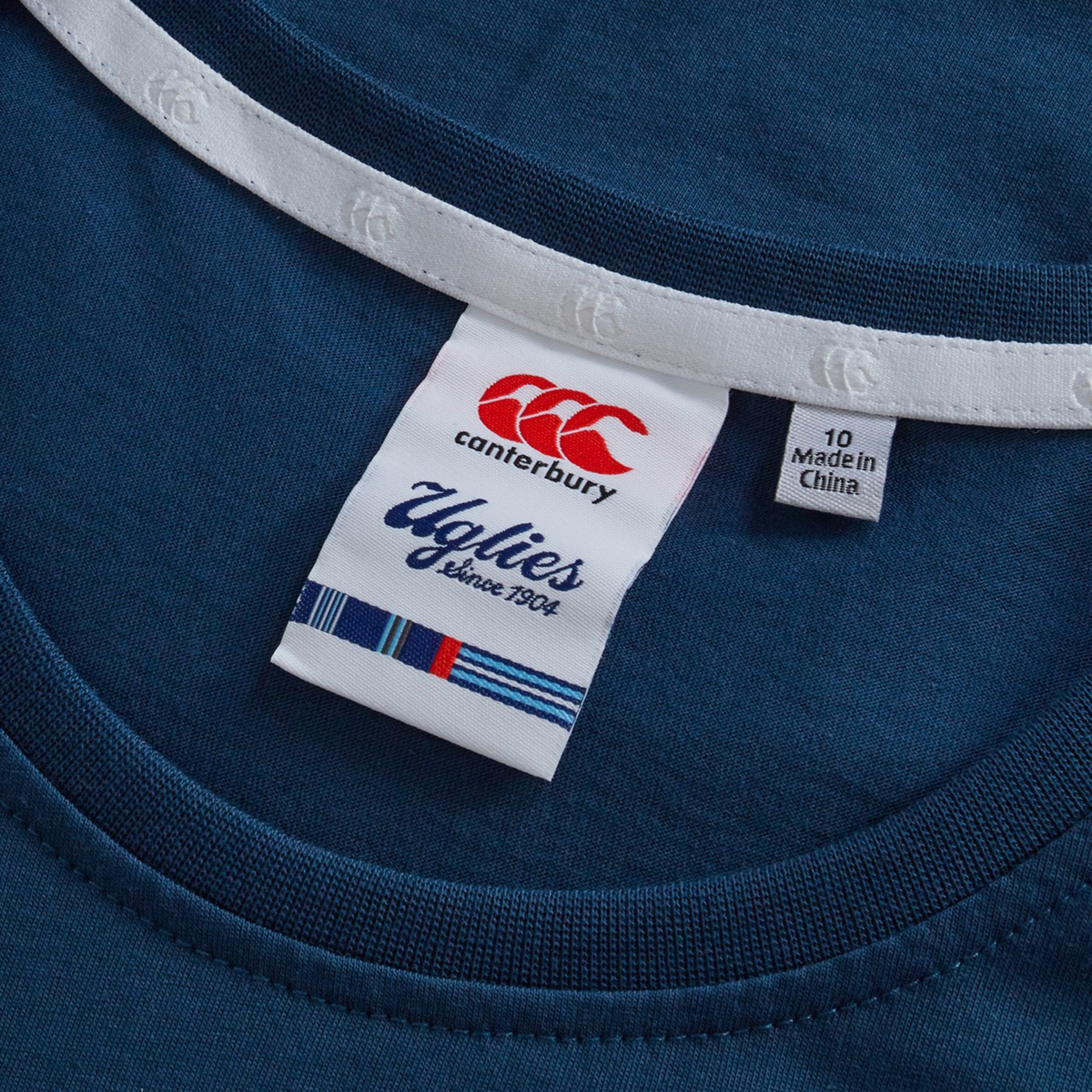 A close-up of the Canterbury Women's Uglies Logo T-Shirt showcases its bold design—an iconic addition to women's rugby apparel.