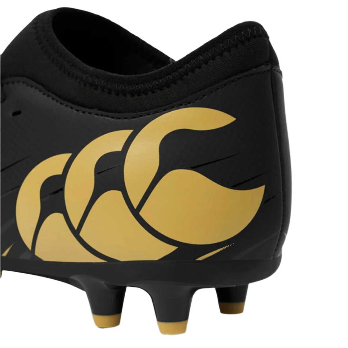 Close-up of the heel of the Canterbury Speed Falcon Team FG rugby boot in black, featuring gold studs and a gold stylized Canterbury logo on the side.