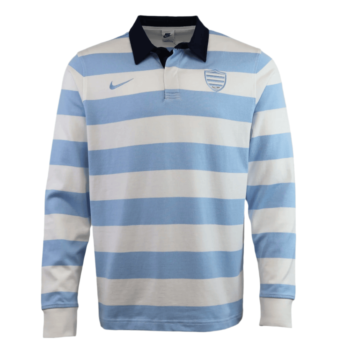 The Racing 92 25/26 Heritage Long Sleeve Rugby Jersey by Nike features light blue and white stripes, a black collar, and the Nike logo with shield emblem on the chest.