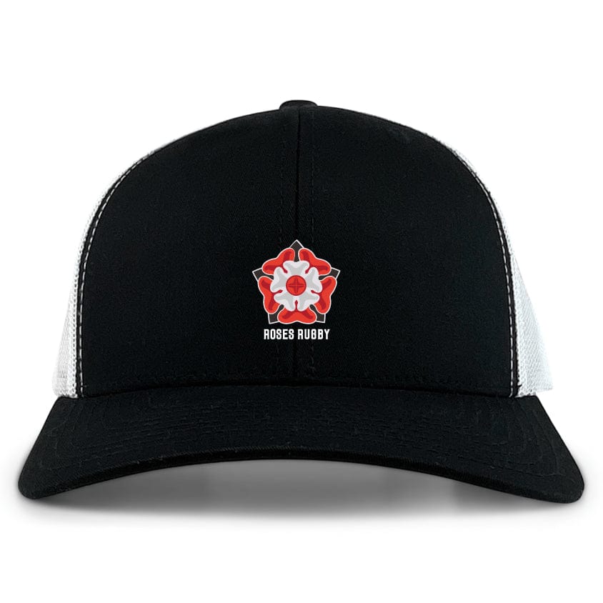 The Roses Rugby Retro Trucker Cap by EMB S&S Activewear features a black and white design with a red and white rose emblem, "ROSES RUGBY" text, a polyester-cotton blend, and an adjustable snapback closure.