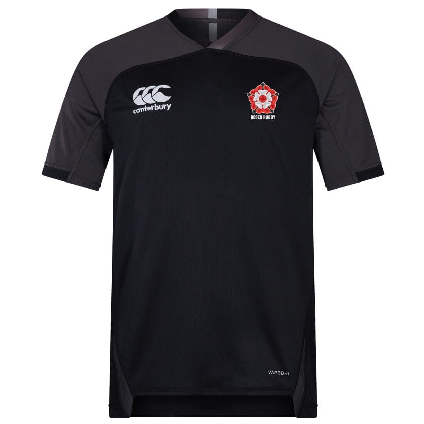 The Roses Rugby Vapodri Evader Jersey by EMB Canterbury is black with gray sleeves and collar, featuring a "Canterbury" logo on the left chest and a red flower emblem with "Rugby Rugby" on the right. It utilizes VapoDri technology for advanced moisture-wicking comfort.
