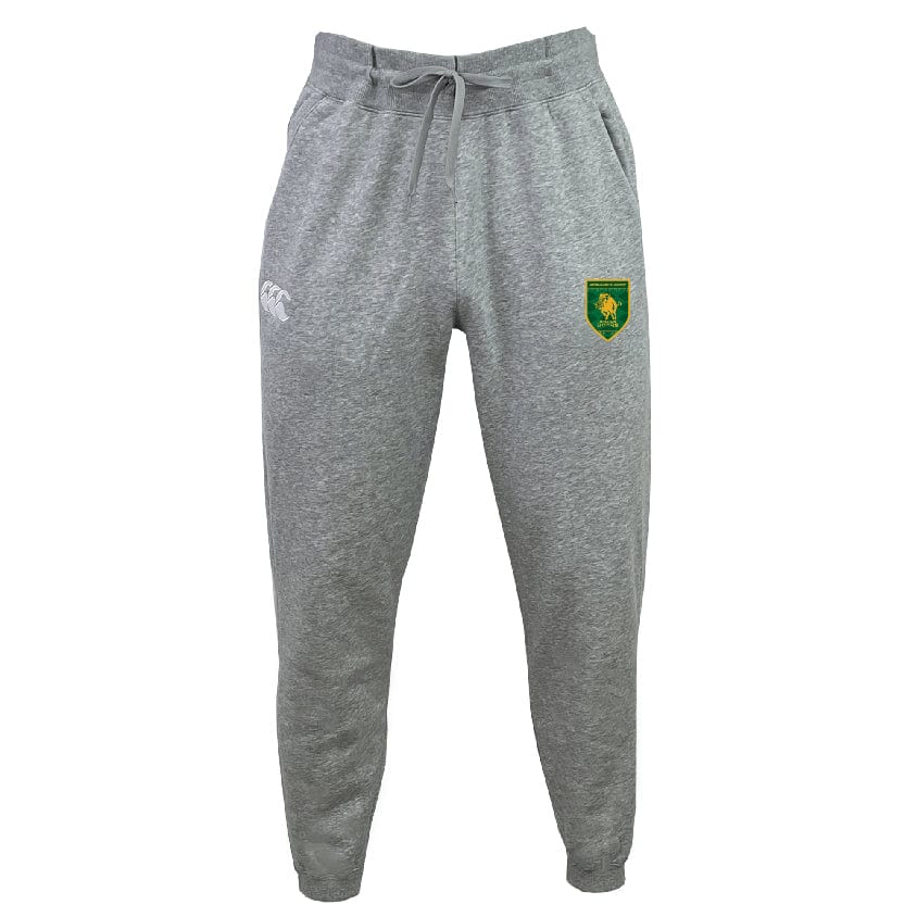 The Riverlands Rugby Leisure Sweatpant by EMB Canterbury is made with recycled polyester fleece and organic cotton, featuring an elastic waistband, drawstring, side pockets, a white logo on the left thigh, and a green and yellow crest on the right.