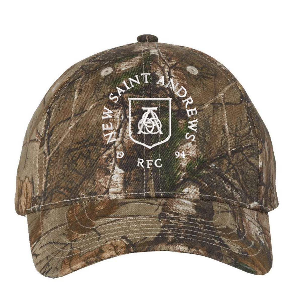 The New Saint Andrews College Realtree Camo Cap by EMB S&S Activewear features “New Saint Andrews RFC 1994” and a white shield logo printed on the front. This adjustable hat blends style and comfort, making it perfect for any outdoor occasion.