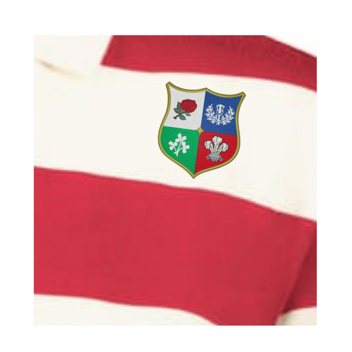 The Women's Vintage British & Irish Lions Prep Street Rugby Crop by EMB Augusta is a red and white striped rugby shirt featuring a crest with the red rose, thistle, shamrock, and three feathers.