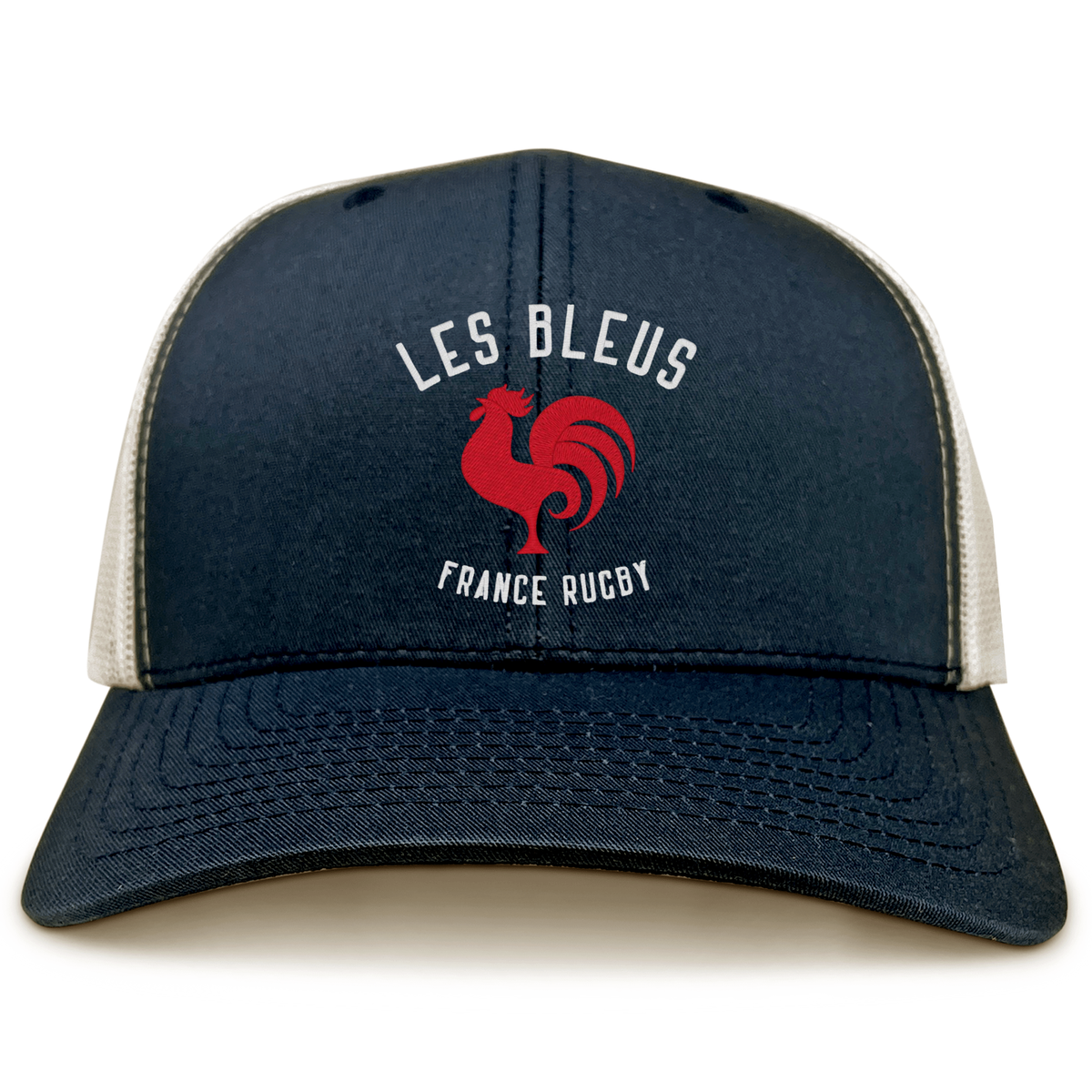 The Les Bleus France Rugby Retro Trucker Cap by EMB S&S Activewear features a bold red rooster graphic and “LES BLEUS” and “FRANCE RUGBY” text on navy blue and beige, perfect for France Rugby fans.