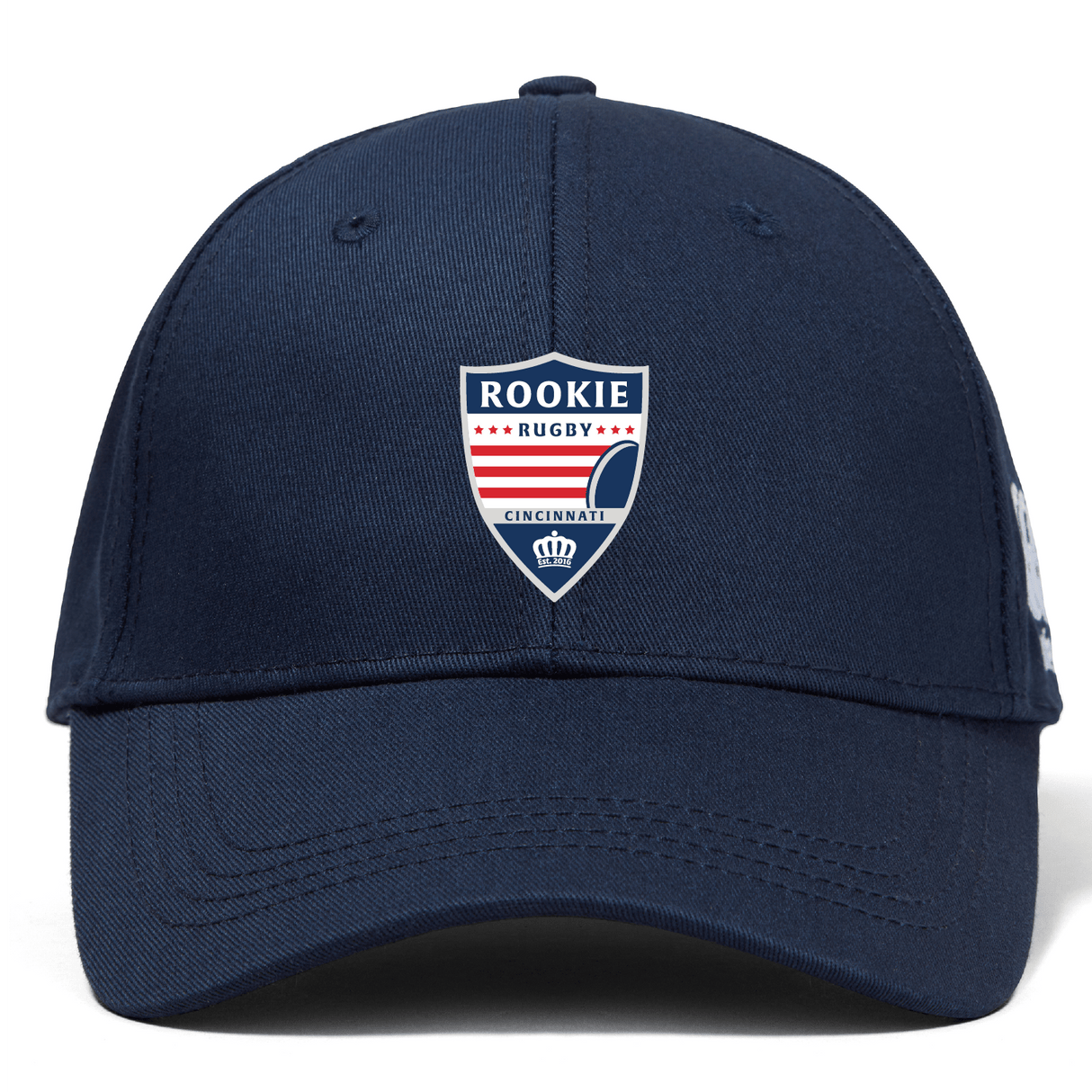 Navy blue flat peak cap with "Cincinnati Rookie Rugby" Flexfit Drill Cap by EMB Canterbury logo embroidered on the front, displayed against a white background.