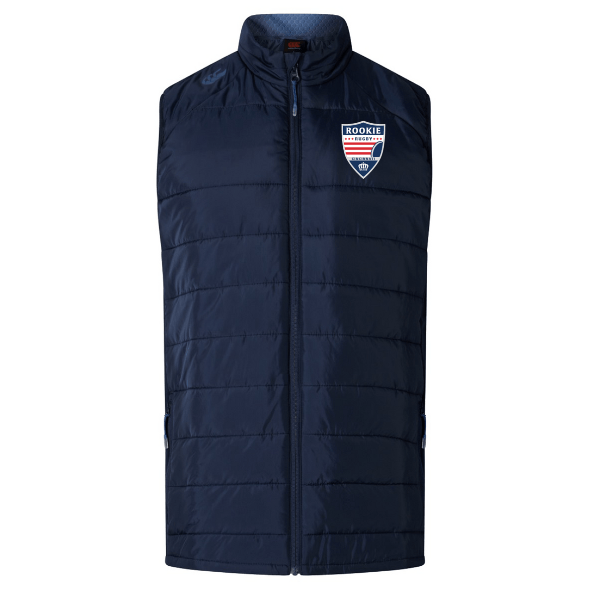 Navy blue padded Cincinnati Rookie Rugby Elite Microlite Gilet by EMB Canterbury with a high collar and zip-up front, featuring a "rookie" badge on the left chest.