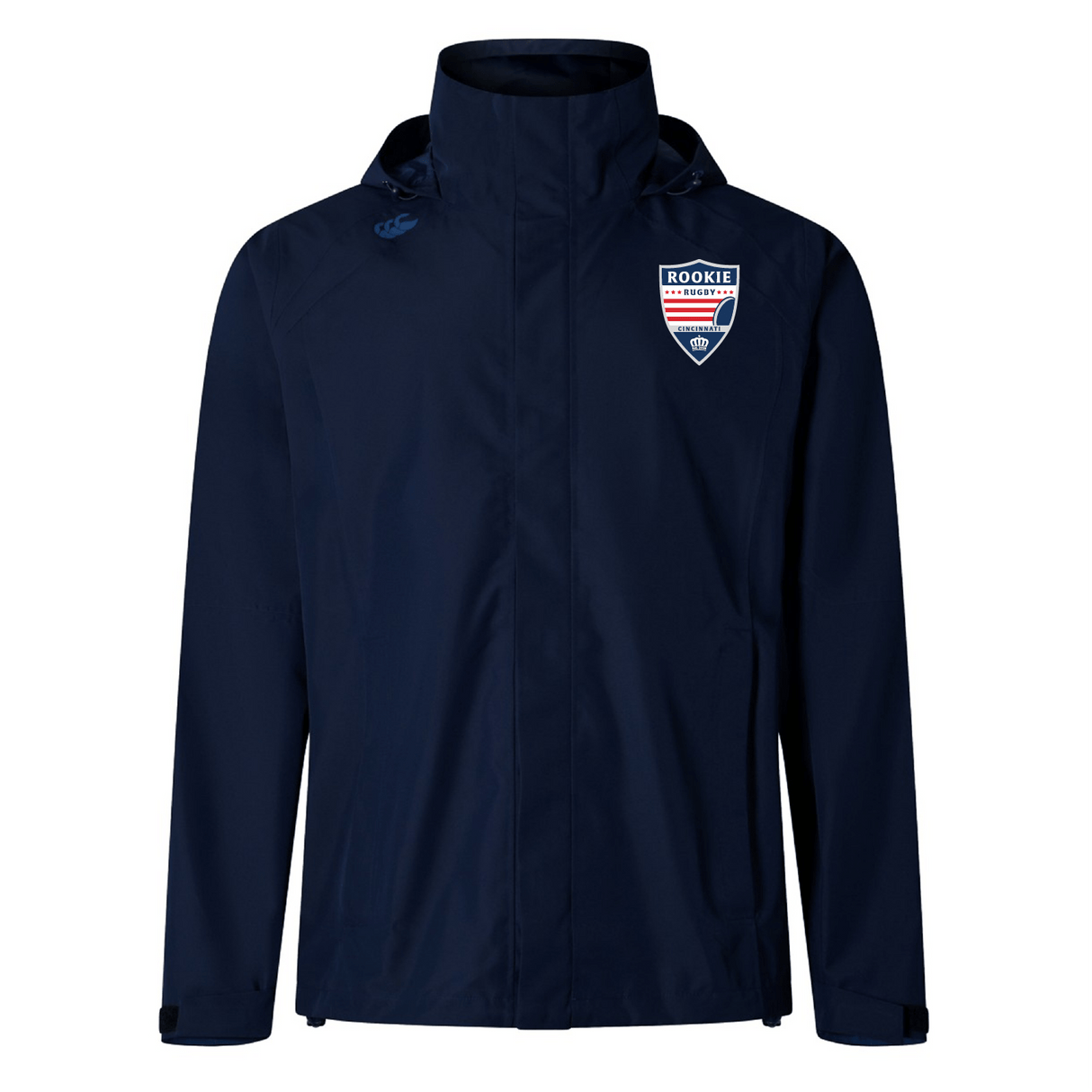 EMB Canterbury Cincinnati Rookie Rugby Elite Storm Jacket, an navy blue waterproof sports jacket with a high collar and a "rookie" badge on the left chest, displayed against a white background.
