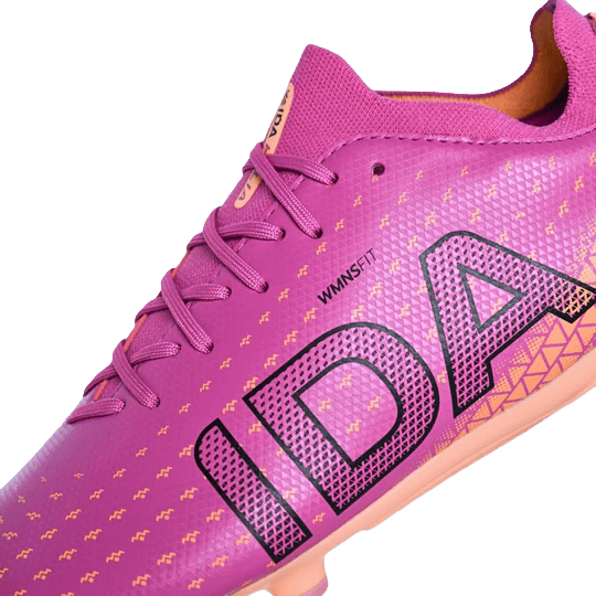 Close-up of the IDA Helia Club SG - Dark Pink by IDA Sports, a women's soft ground soccer boot with purple laces, bold "IDA" branding, and a geometric pattern—ideal for players seeking stylish soccer cleats.