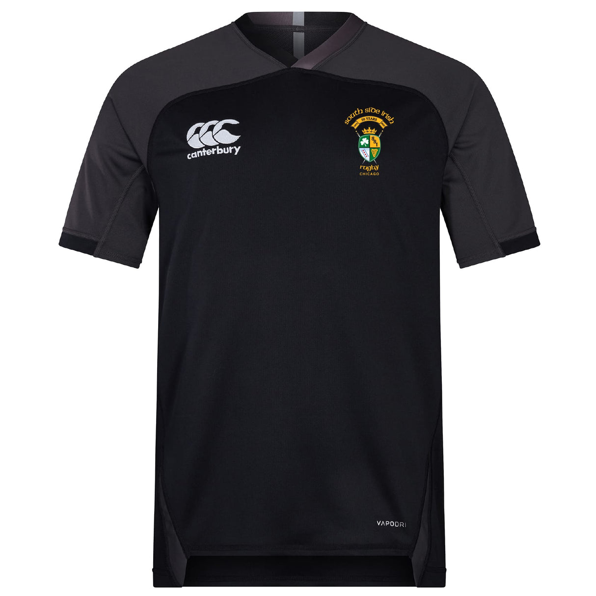 The South Side Irish 50th Anniversary Vapodri Evader Jersey by EMB Canterbury is a black short-sleeve rugby shirt with the Canterbury logo on the right chest and a multicolored crest on the left, featuring moisture-wicking technology for comfort.