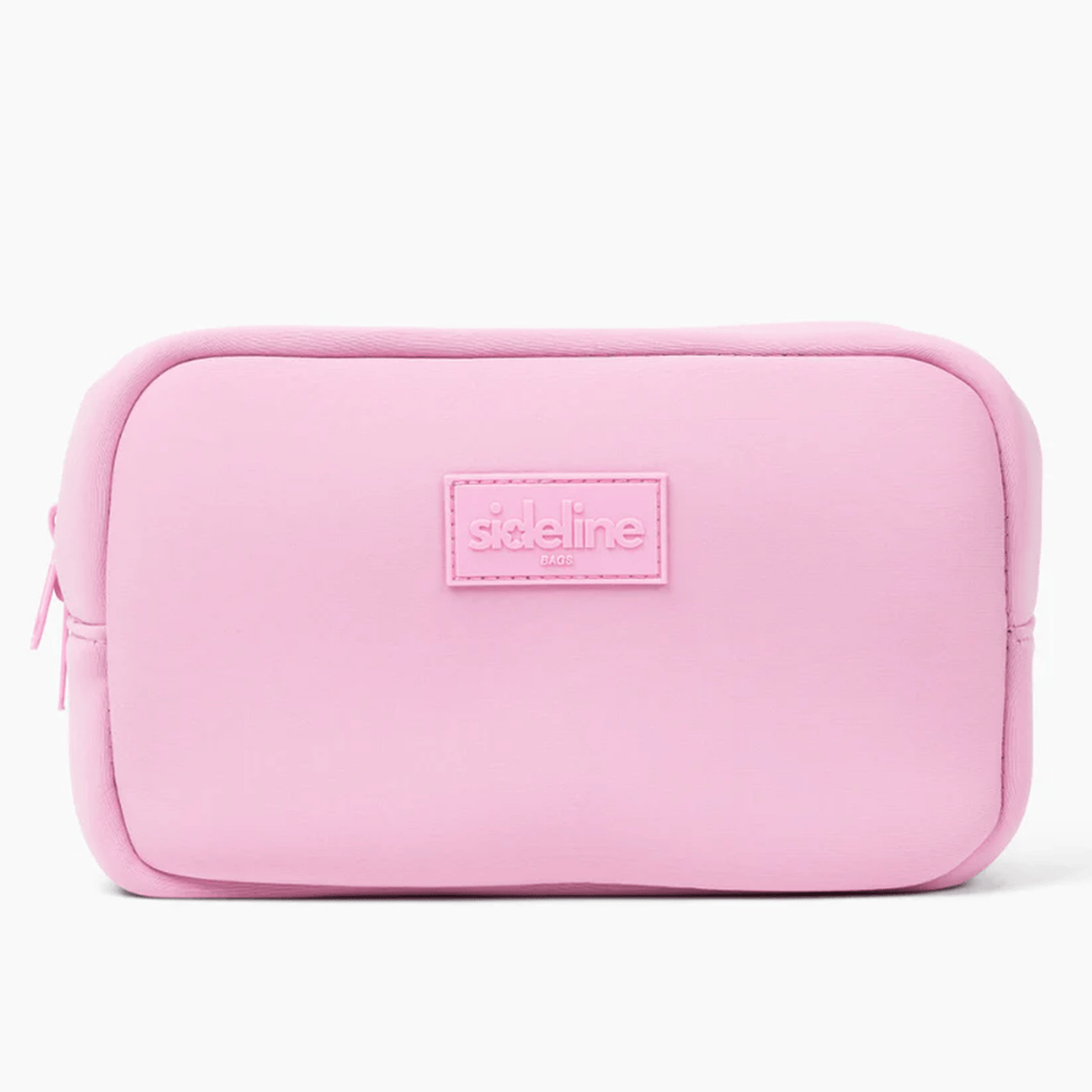 The Original Side Line Bag by SLB is a rectangular light pink waterproof neoprene zippered organizer featuring a stitched "sideline NYC" label on the front, designed for female athletes.