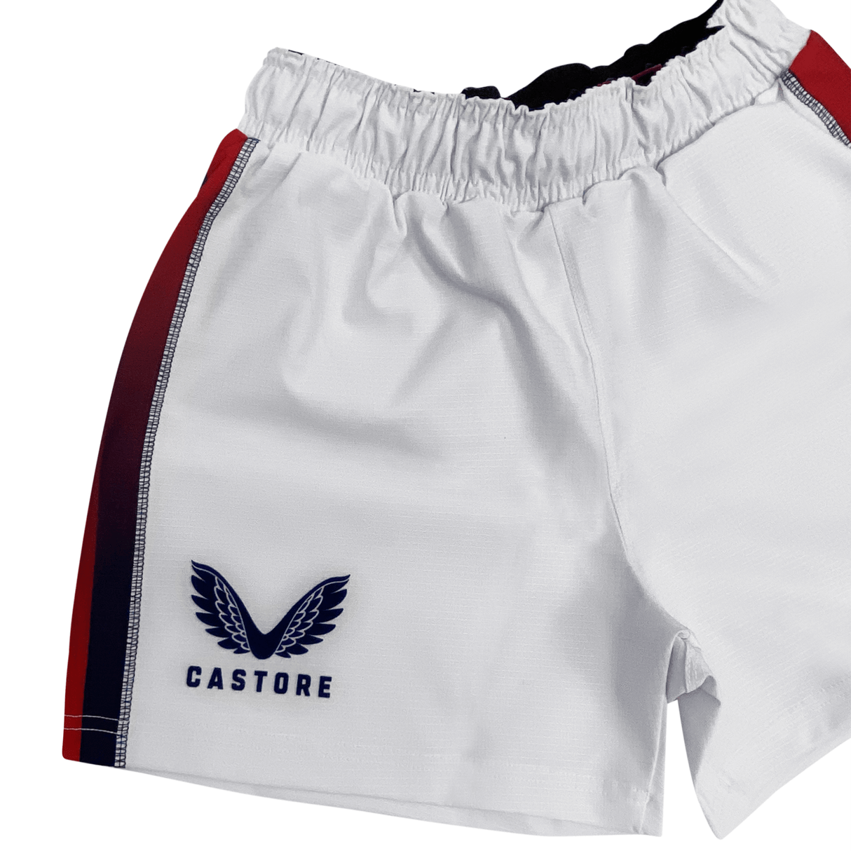 The USA Rugby 22/23 Pro Home Short by Castore features white fabric, red and navy side stripes, an elastic waistband, and Castore branding—perfect moisture-wicking gear for any rugby supporter.