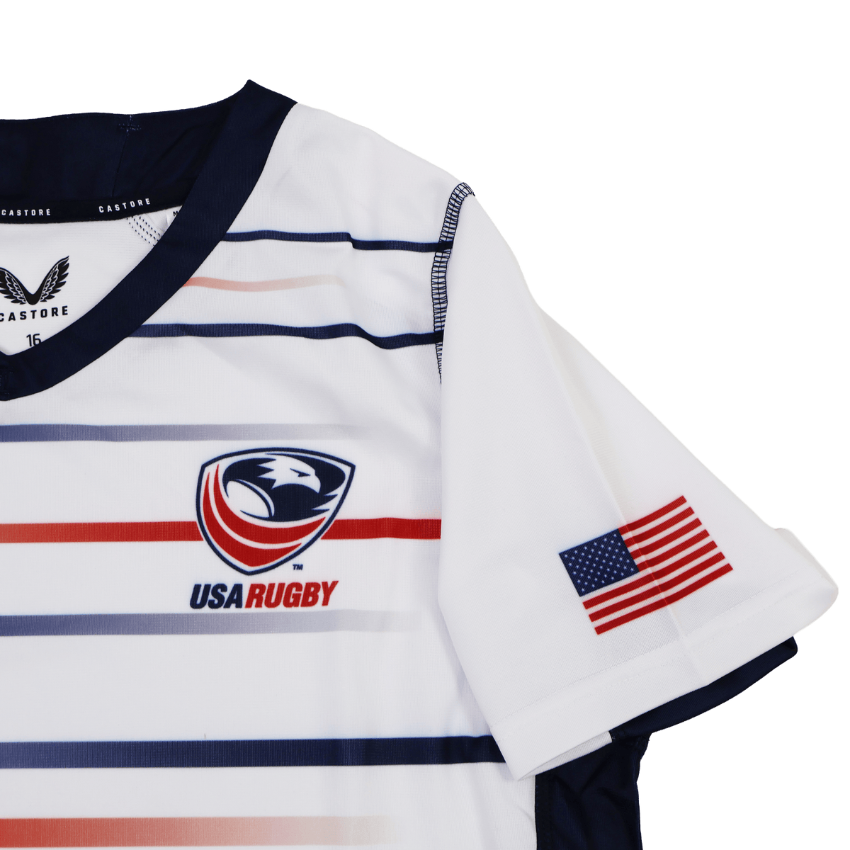 The Castore Women's USA Rugby Replica Home Jersey 22/23 features horizontal red, white, and blue stripes, the USA Rugby chest logo, and an American flag patch on the sleeve—ideal for fans seeking an authentic women's rugby jersey.
