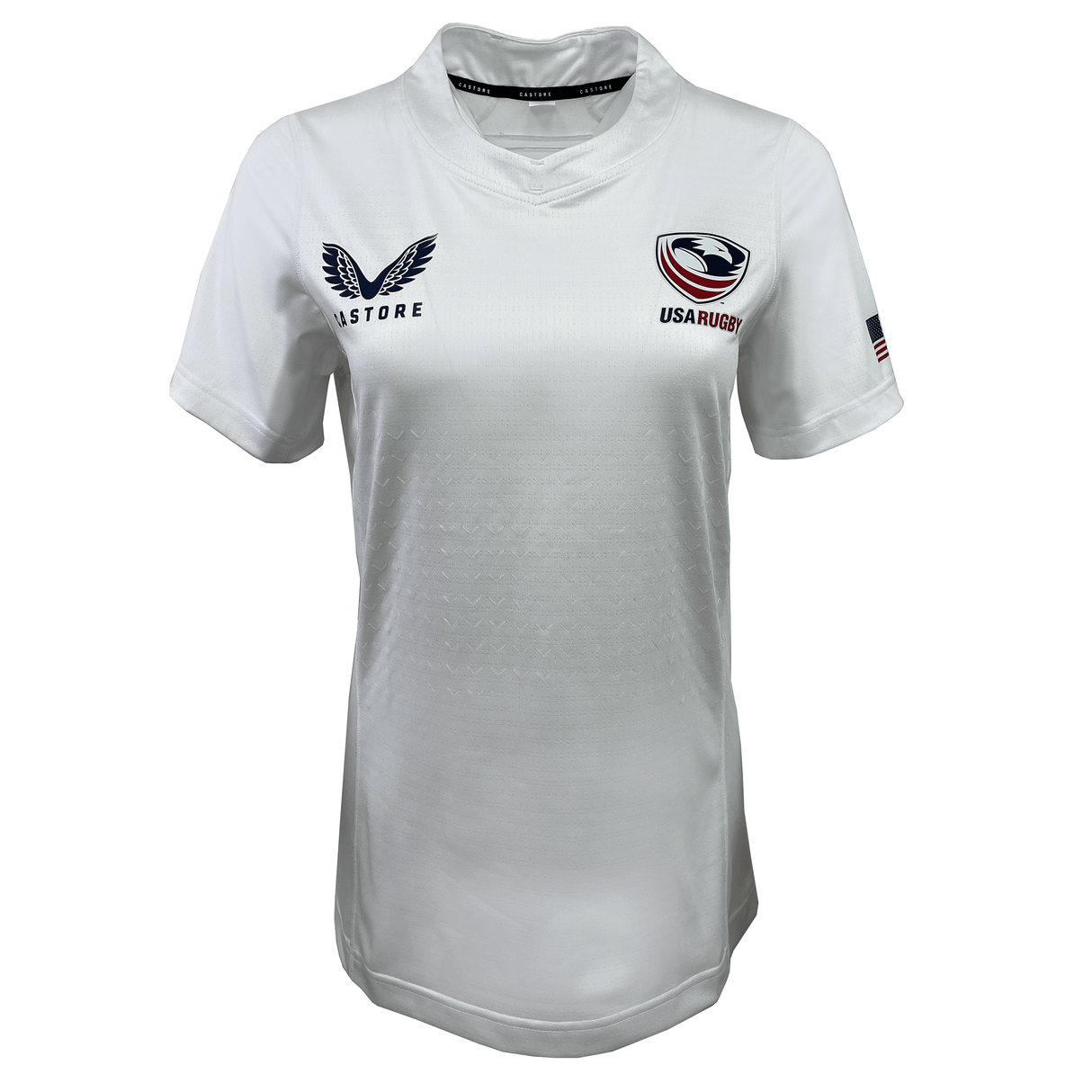 The Women's USA Rugby 23/24 Training Jersey by Castore is a white jersey featuring the USA Rugby logo, Castore branding, and a small American flag on the right sleeve.
