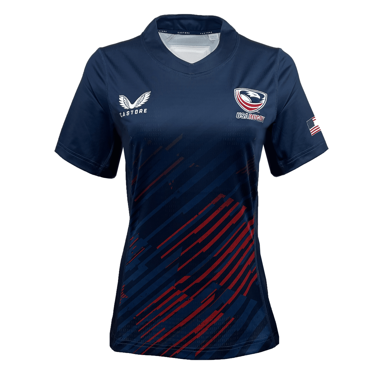 The Women's USA Rugby 24/25 Pro 7's Home Jersey by Castore features a navy design with red diagonal stripes, a white Castore logo on the left chest, an eagle emblem on the right chest, and an American flag on the left sleeve.