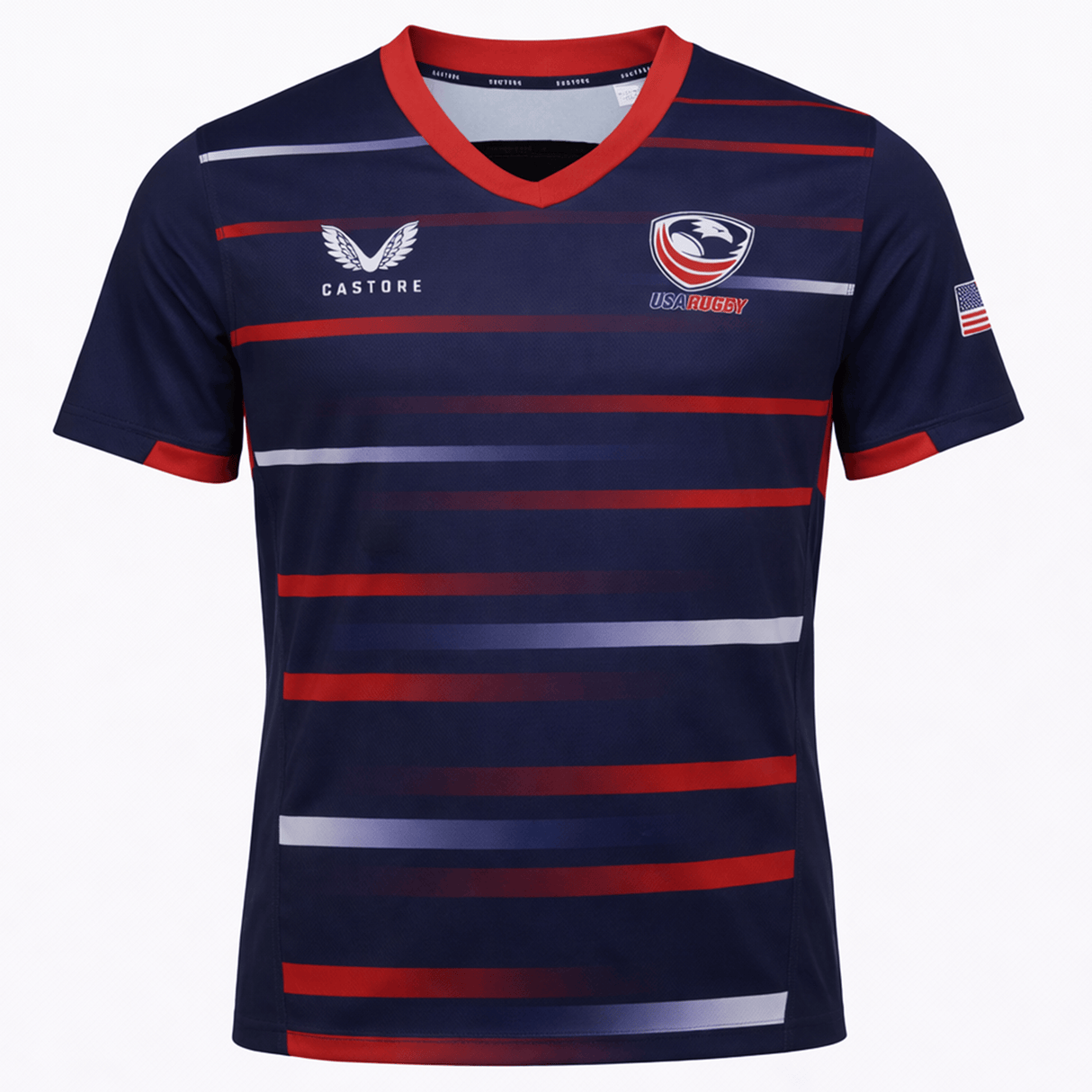 The USA Rugby 22/23 Pro Away Jersey by Castore features navy blue with red and white horizontal stripes, a red V-neck, Castore and USA Rugby logos, plus an American flag patch on the sleeve.