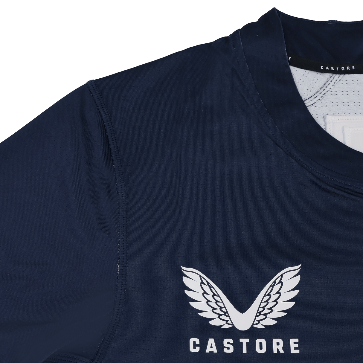 Close-up of the USA Rugby 23/24 Training Jersey by Castore in navy blue, featuring Castore's white winged logo, "CASTORE" text, and a subtle USA Rugby detail on the chest.