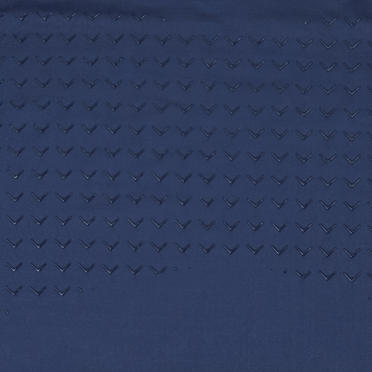 The USA Rugby 23/24 Training Jersey by Castore features dark blue fabric with a repeated pattern of small, raised chevron shapes in diagonal rows—delivering a sleek look for your training sessions.