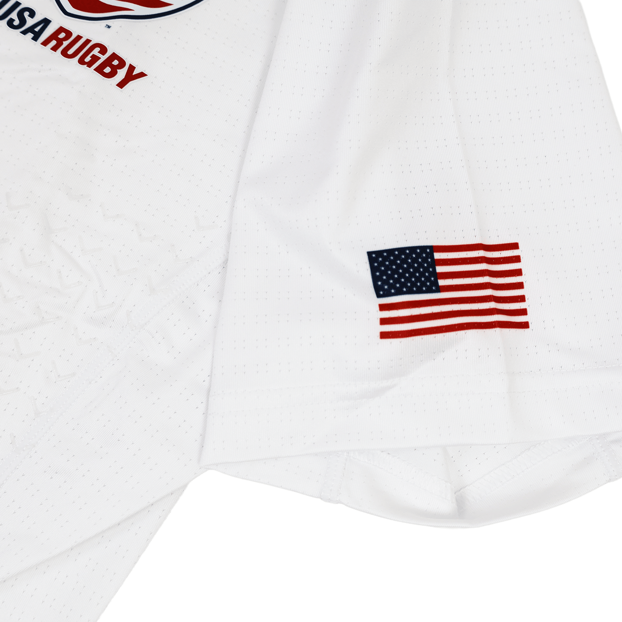 The USA Rugby 23/24 Training Jersey by Castore features a small American flag patch and partial "USA RUGBY" text on the upper left.