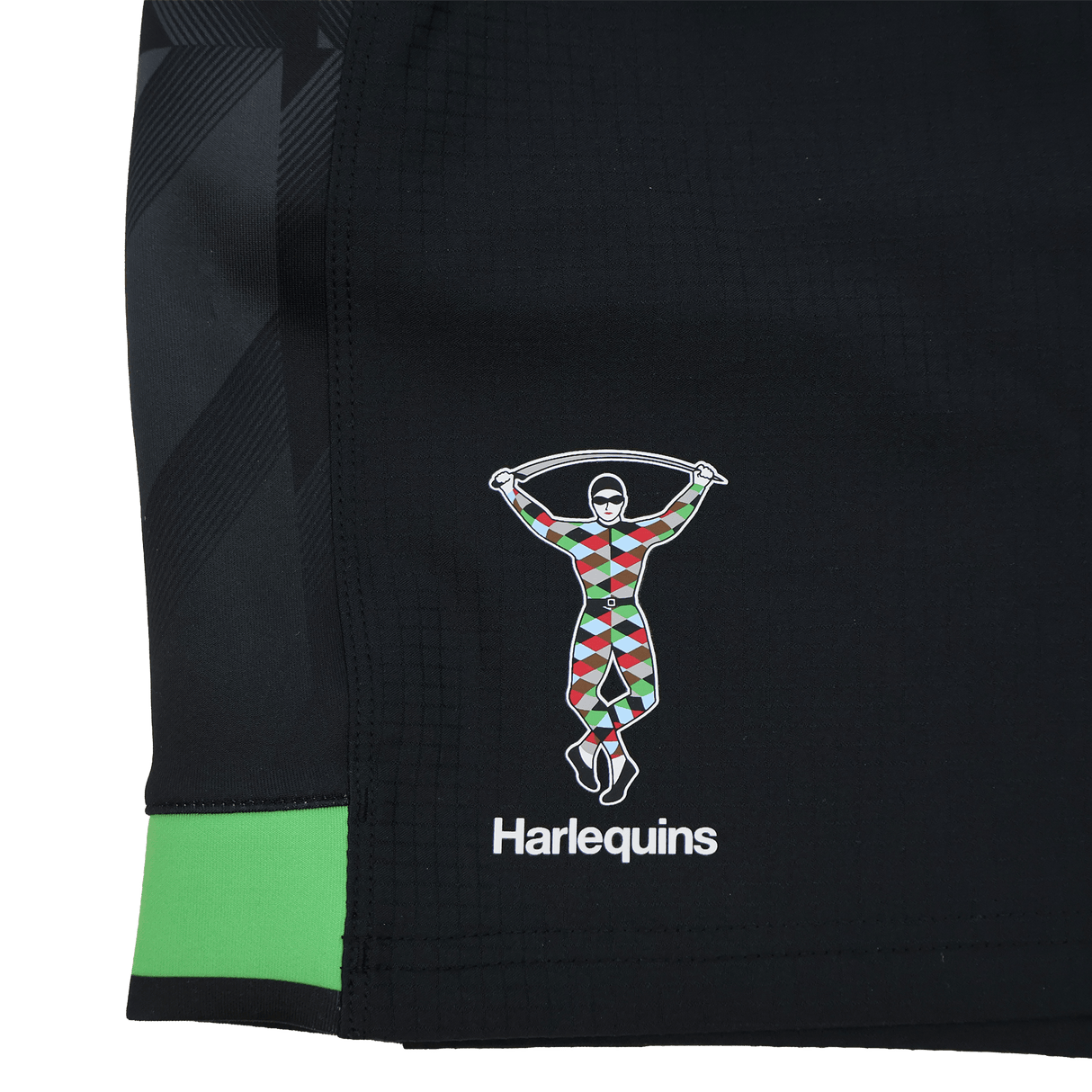 Close-up of the Harlequins 23/24 Home Shorts by Castore, featuring a black design with the club’s colorful harlequin figure and "Harlequins" printed beneath.