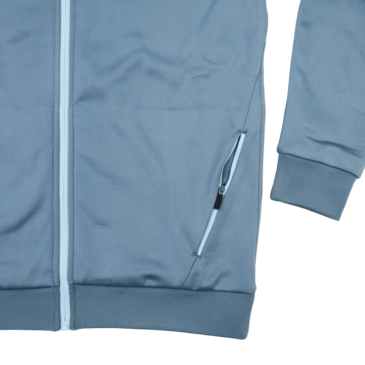 A close-up of the Castore Harlequins 23/24 Matchday Zip Through Hoodie, inspired by rugby teamwear, featuring a zipper pocket plus ribbed cuffs and hem.