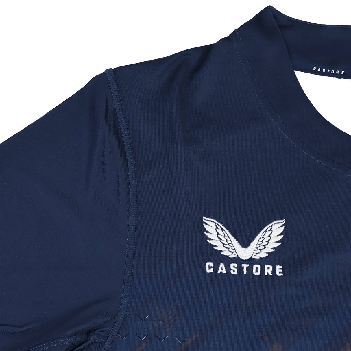 The USA Rugby 24/25 Pro Home Jersey by Castore features navy blue fabric, white embroidered Castore wings and "CASTORE" text on the chest, inspired by the official USA Rugby design.