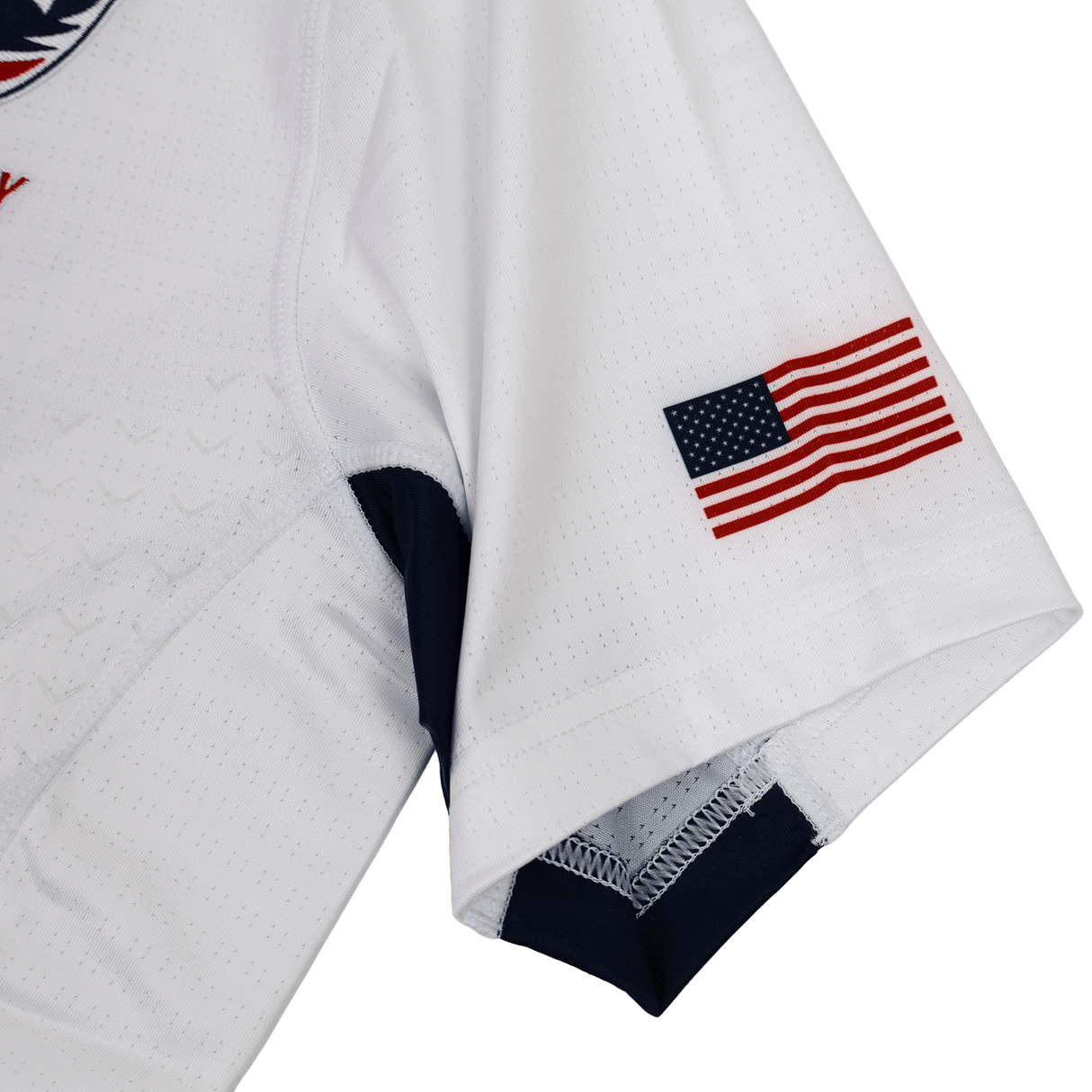 A close-up of the USA Rugby 24/25 Pro 7s Away Jersey sleeve by Castore, showing a small American flag patch near the hem.