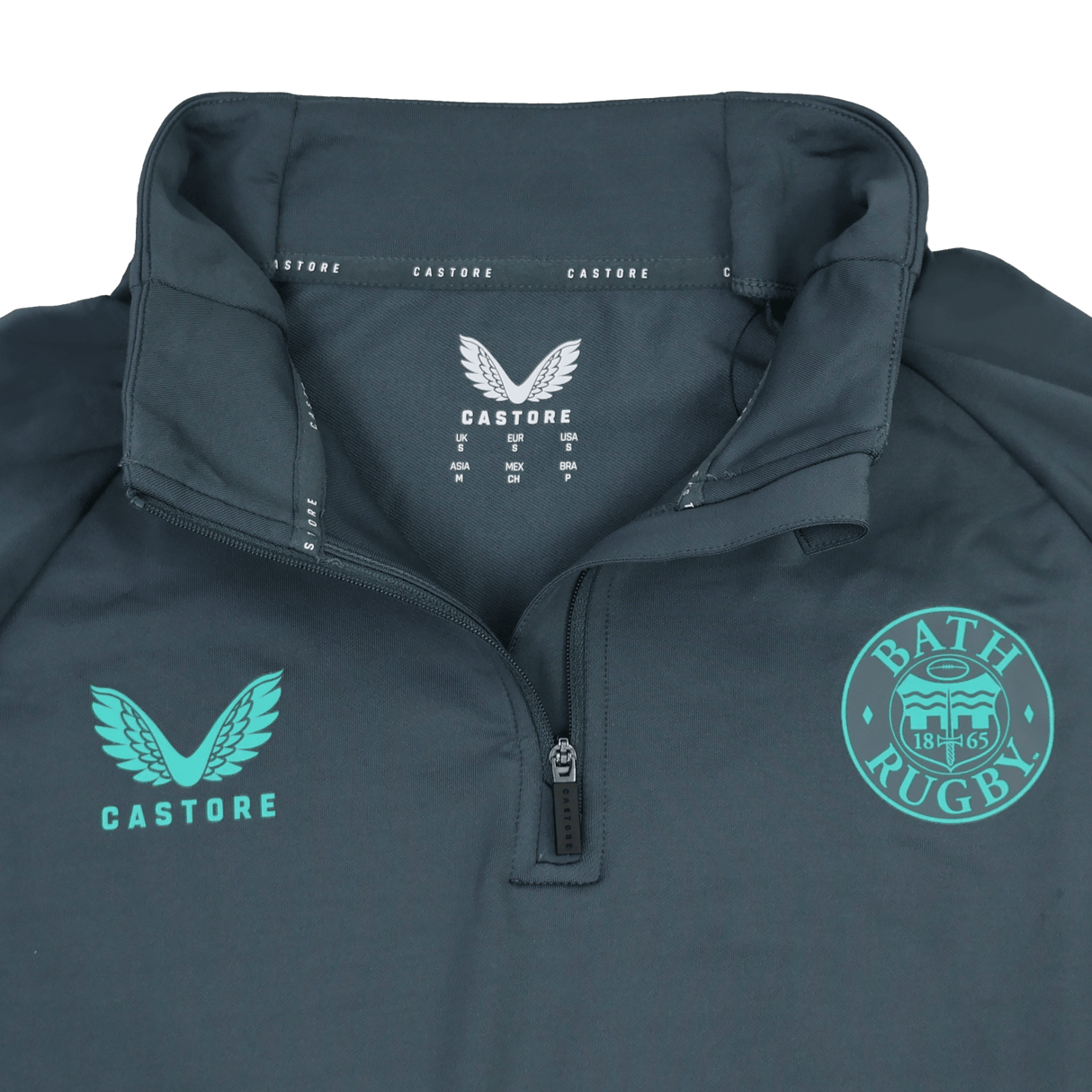 The Bath 24/25 Pro Players 1/4 Zip Midlayer by Castore features moisture-wicking fabric and displays the "BATH RUGBY" emblem alongside the Castore logo in teal on the chest.