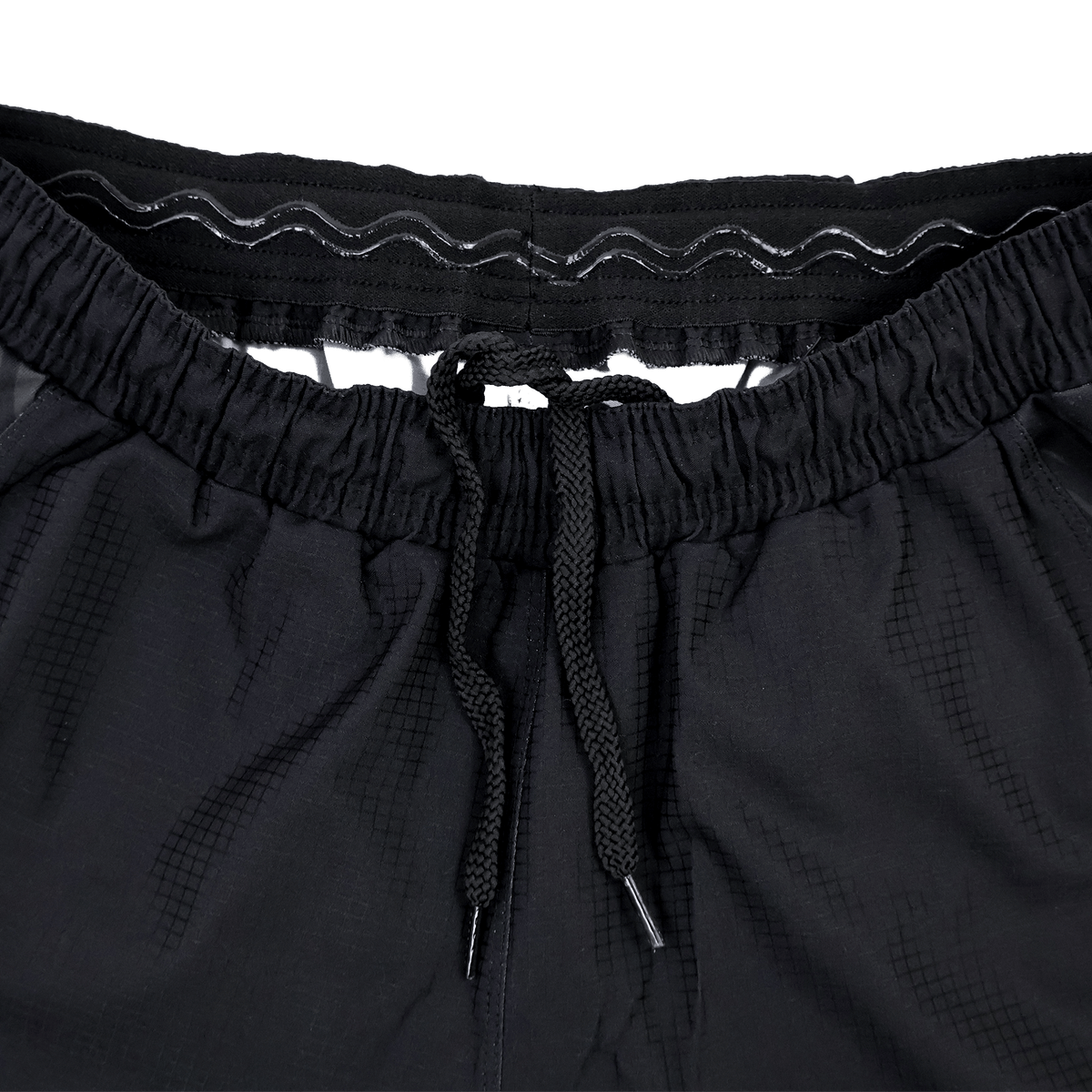 Close-up of the waistband on Saracens 23/24 Pro Home Shorts by Castore, showing a drawstring and internal elastic band with silicone grip strip.