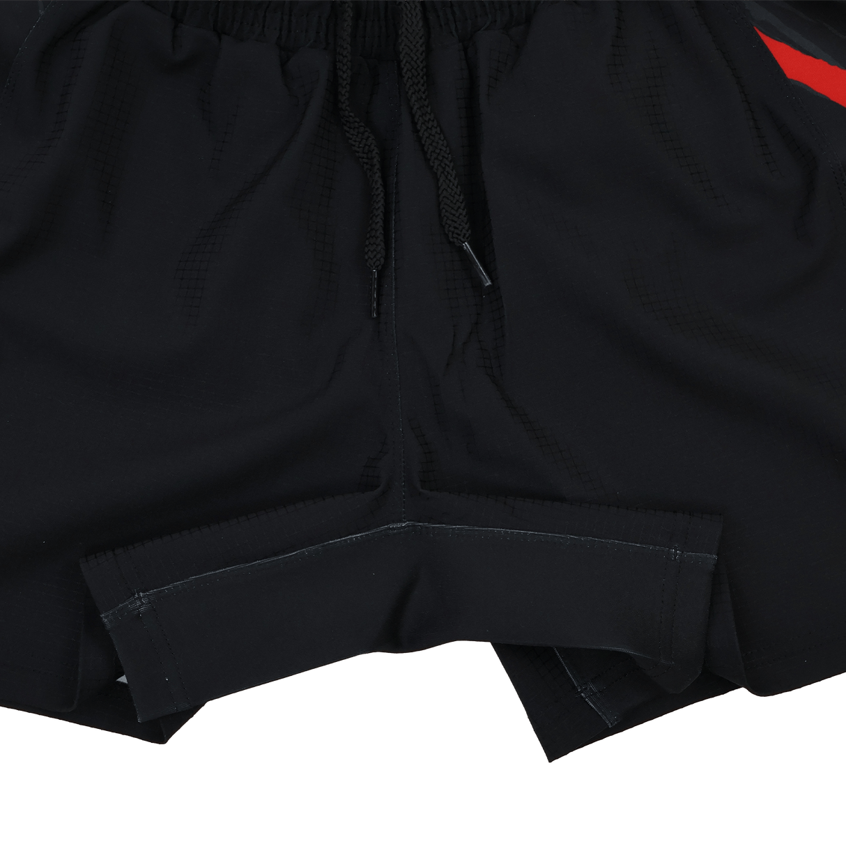 Close-up of Castore Saracens 23/24 Pro Home Shorts with an elastic waistband, black drawstrings, and a small red stripe on the right side.