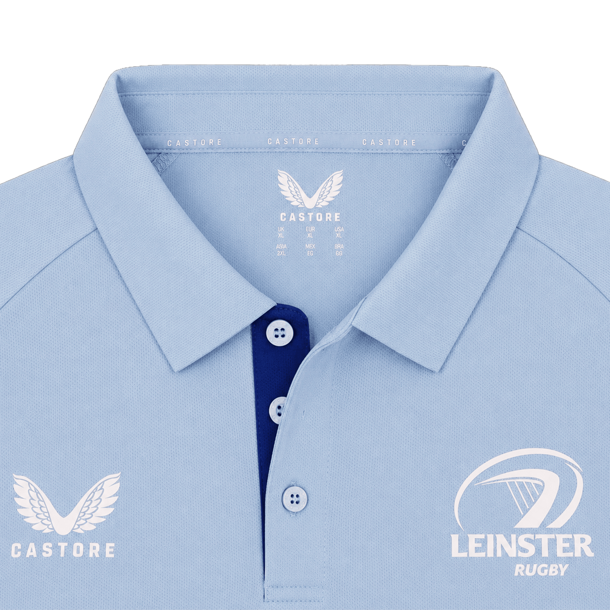 The Leinster 24/25 Pro Players Media Polo by Castore features a light blue design with a collar, Castore logo on the left chest, Leinster Rugby logo on the right chest, and contrasting blue buttons.