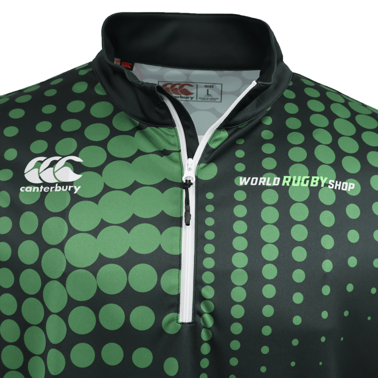 Close-up of the Teamatical Canterbury Eco-Sublimate Mid-Layer Q-zip for men, a black and green rugby shirt with a sublimated dotted pattern, quarter zip collar, and lightweight stretch polyester construction.