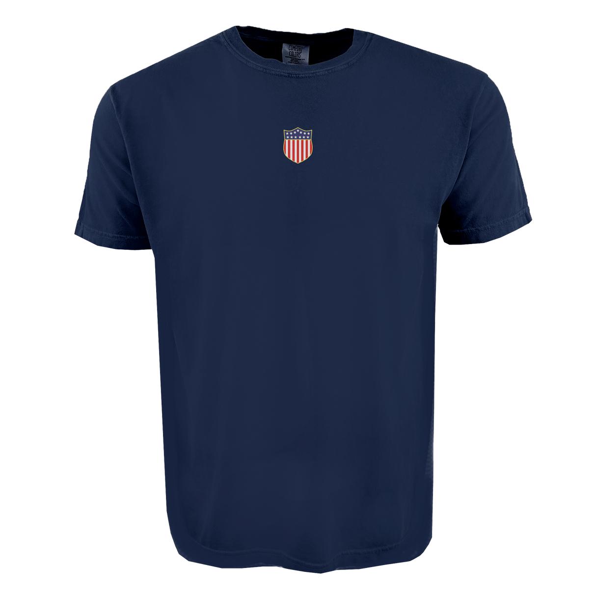 The EMB S&S Activewear USA Rugby Elevated Original Olympic Comfort Tee is a plain navy blue shirt with a small red, white, and blue shield emblem on the upper chest, from the USA Rugby Through the Decades Collection.