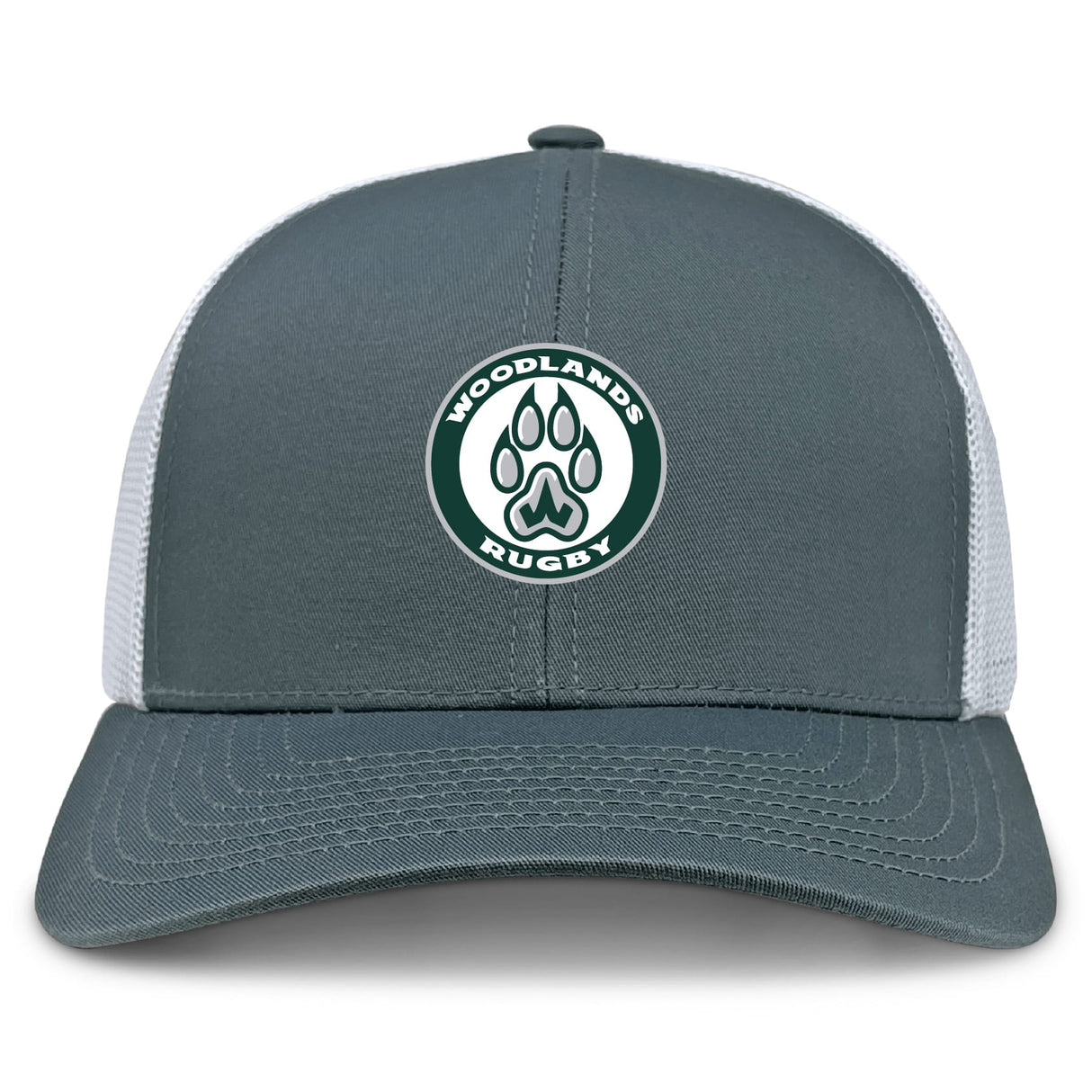 The Woodlands Youth Retro Trucker Cap by EMB S&S Activewear features a gray and white design, an embroidered "Woodlands Rugby" circular logo with a green paw print on the front, and a classic snapback closure.