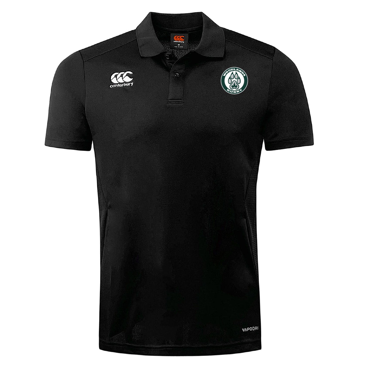 The Woodlands Youth Club Dry Polo by EMB Canterbury features a collar, button placket, and two embroidered logos. Made with Vapodri Technology, this black short-sleeve polo keeps you cool and comfortable all day.