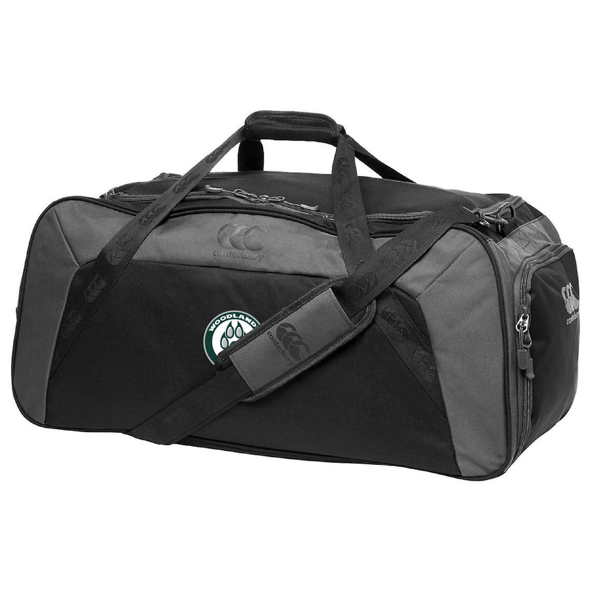 The Woodlands Youth Holdall Duffle Bag by EMB Canterbury is a black and gray water repellent bag with a handle, shoulder strap, "Canterbury" logo, and paw print patch—ideal for rugby athletes on the go.