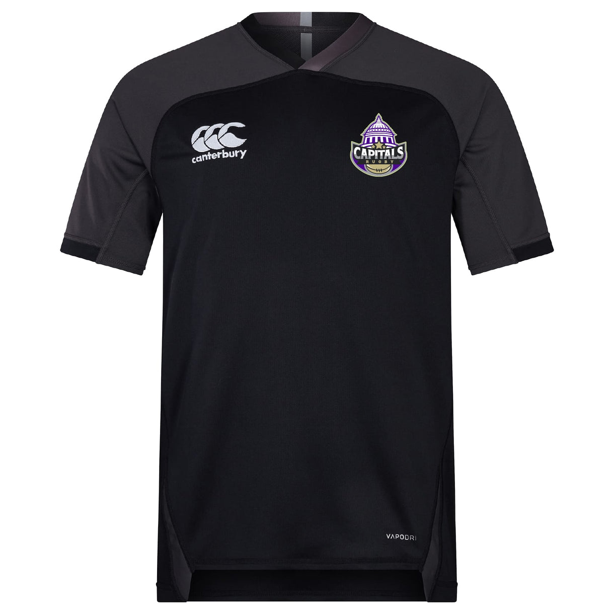 The Capitals Rugby NC Vapodri Evader Jersey by EMB Canterbury is a black short-sleeve jersey with moisture-wicking tech, Canterbury logo on the right chest, and a purple "Capitals" logo on the left.