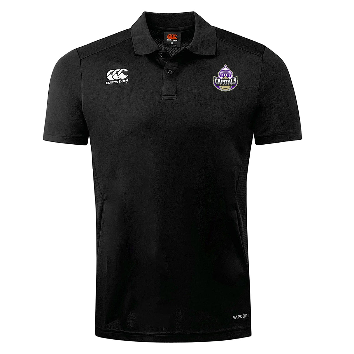 The Capitals Rugby NC Club Dry Polo by EMB Canterbury is a black short-sleeve polo with Vapodri Technology, featuring the Canterbury logo on the right chest and a purple Capitals team crest on the left.