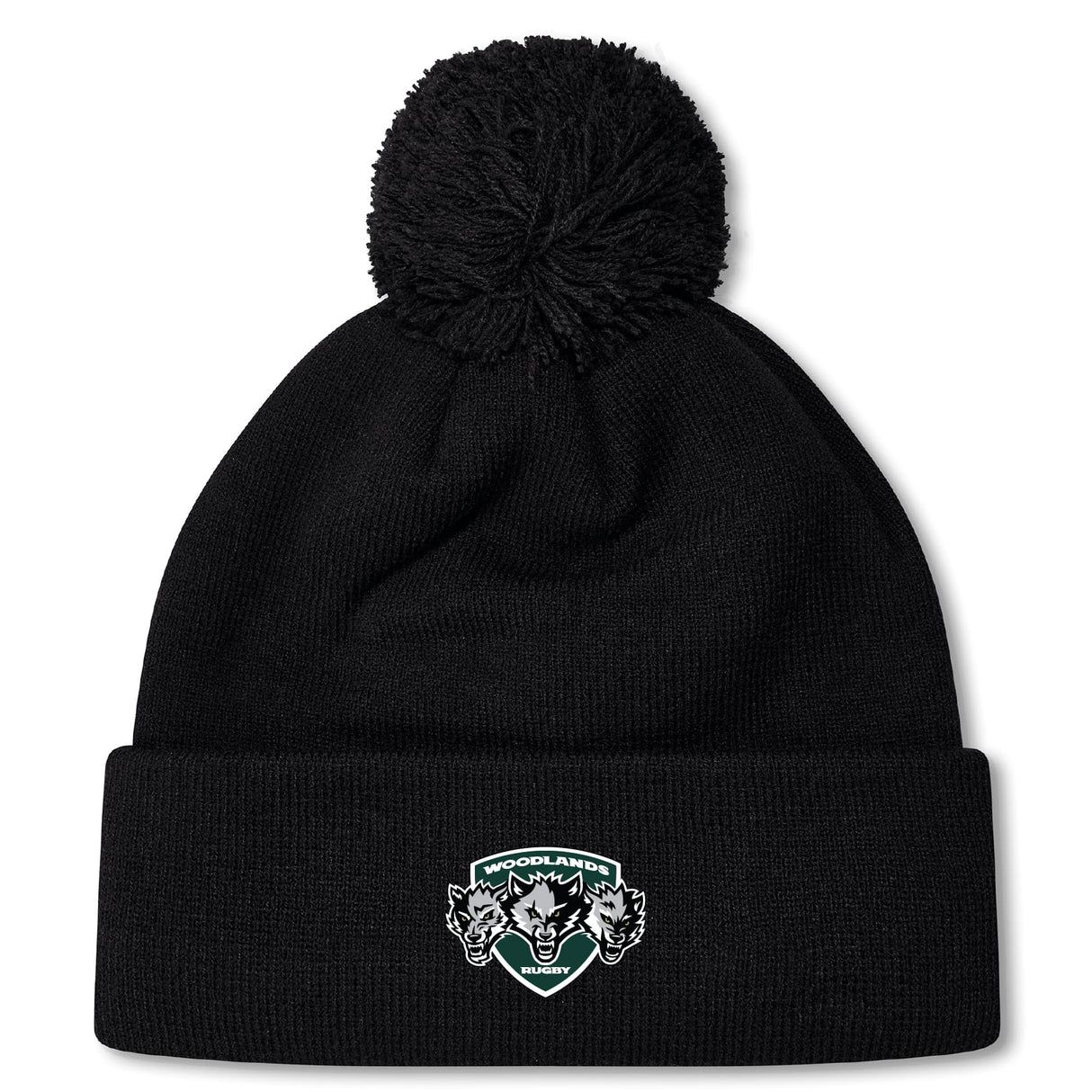 The Woodlands Youth Wolfpack Pom Pom Beanie by Canterbury from EMB Canterbury is a black knit, fleece-lined beanie with a large pom-pom and a "Woodlands Rugby" logo patch with three wolves on the folded brim.