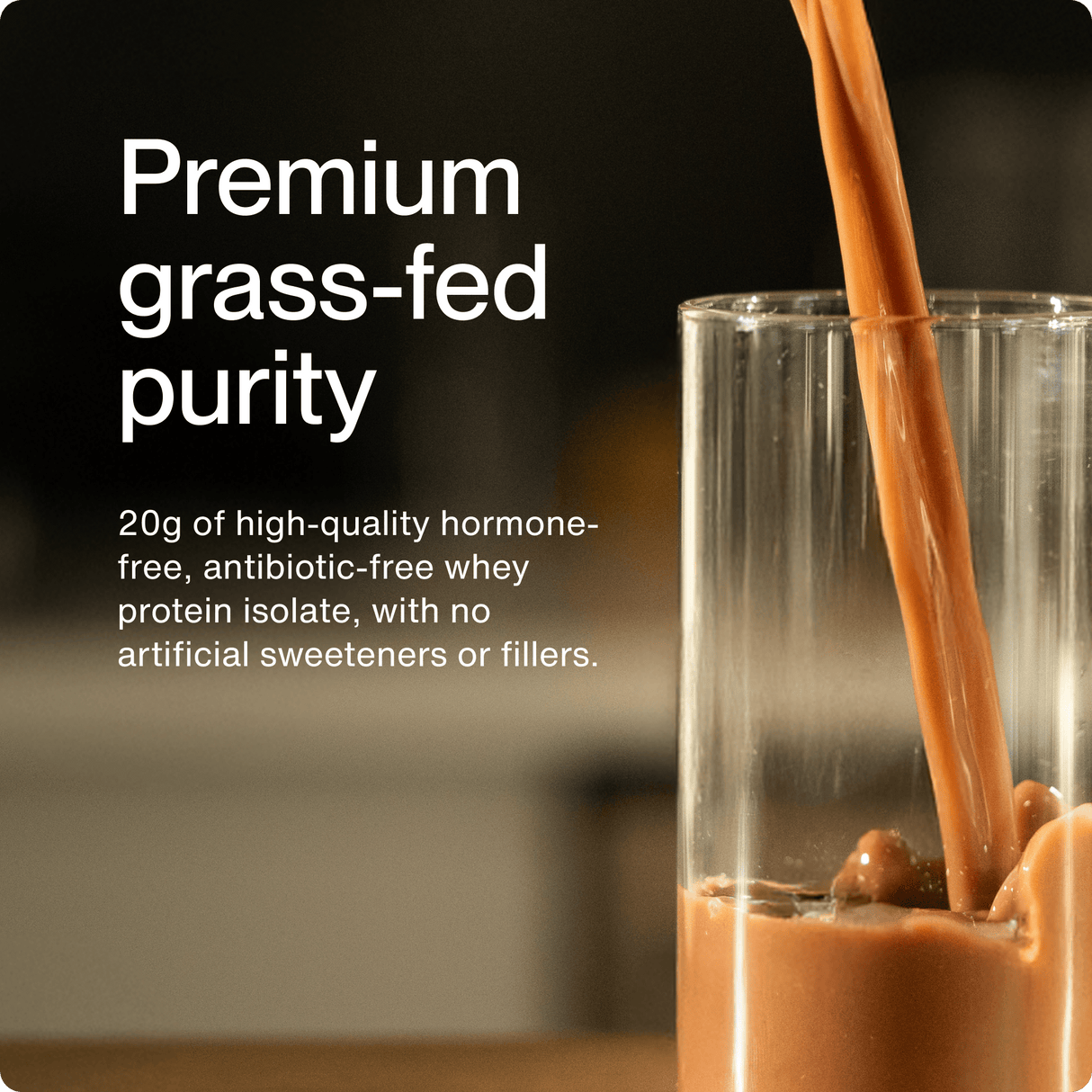 A glass is being filled with Momentous Whey Protein Isolate by Momentous, a chocolate shake made with premium grass-fed protein for muscle recovery and no artificial ingredients.