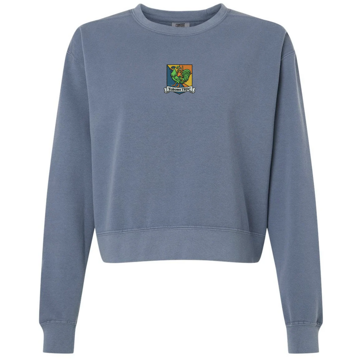 Blue mid-length heavyweight fleece Takoma Touch Rugby Women’s Garment-Dyed Mid-Length Crewneck Sweatshirt featuring a small chest crest with a rooster and the text “Takoma TRFC”.