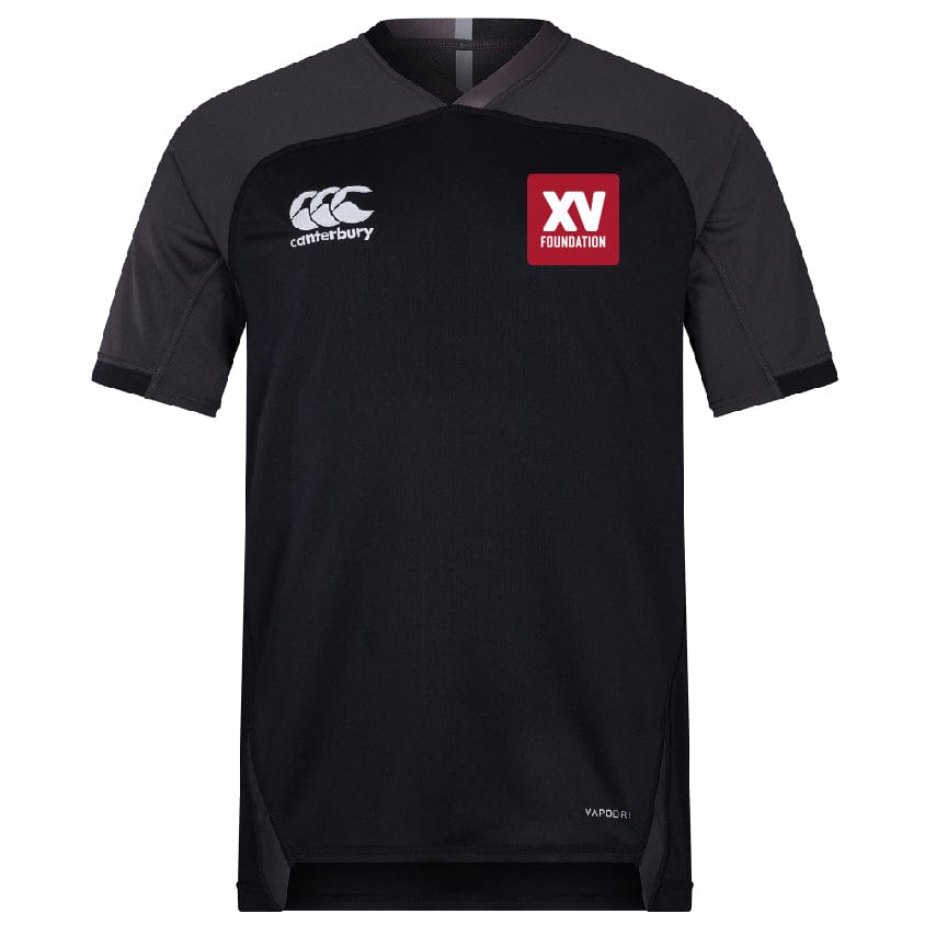 The EMB Canterbury XV Foundation Vapodri Evader Jersey is a black short-sleeved top with Canterbury and XV Foundation logos, "Vapodri" text near the hem, and moisture-wicking technology inspired by the 2019 Rugby World Cup.