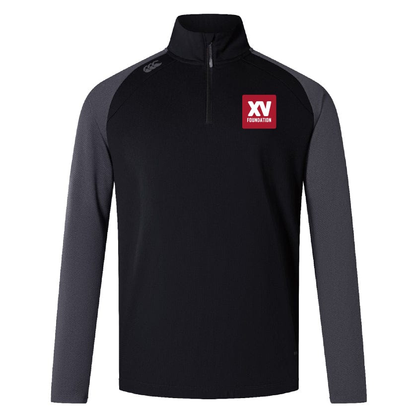The XV Foundation Women's Elite First Layer by EMB Canterbury is a black and dark gray quarter-zip pullover made from recycled polyester honeycomb fabric, featuring a red and white "XV Foundation" logo on the left chest.