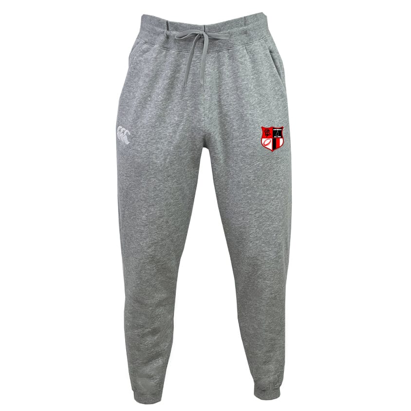 The Amoskeag Rugby Club Leisure Sweatpant by EMB Canterbury is made from recycled polyester fleece and features a white logo on the left pocket, a red, black, and white shield emblem on the right thigh, and a drawstring waist for adjustable comfort.